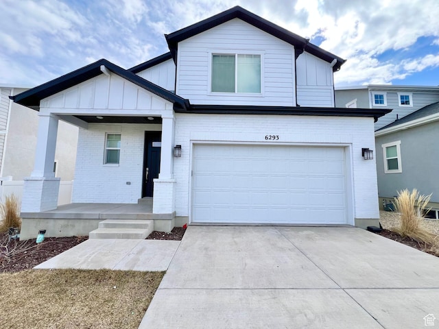 6293 W Jackson Crest Way, Herriman, UT 84096 - view of front of house with a garage, a porch, driveway, and board and batten siding