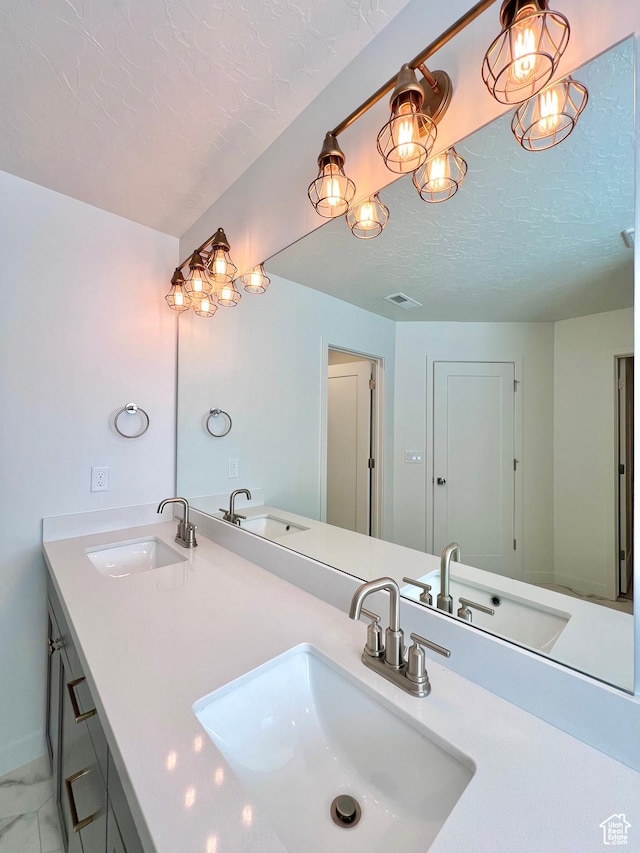 6293 W Jackson Crest Way, Herriman, UT 84096 - bathroom featuring a sink and a textured ceiling