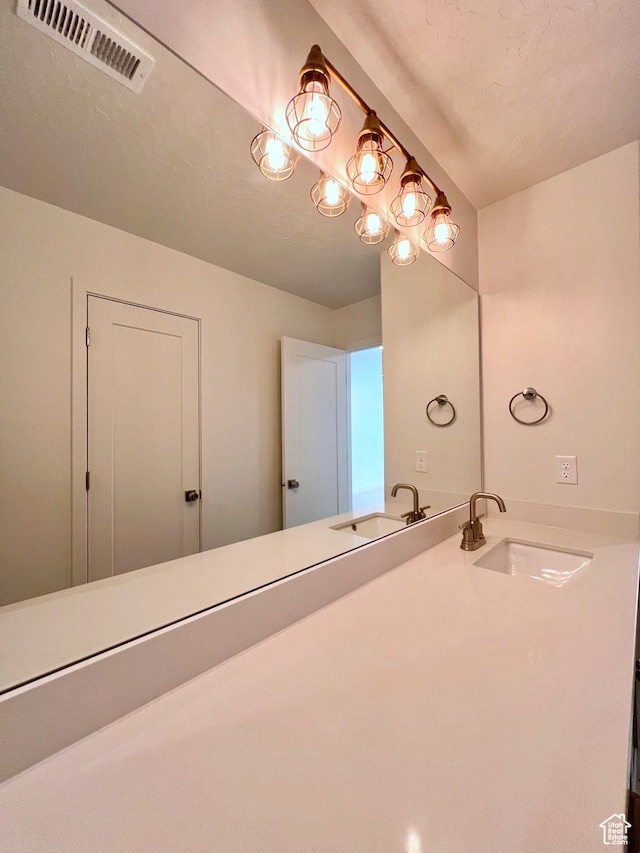 6293 W Jackson Crest Way, Herriman, UT 84096 - bathroom with a sink and visible vents