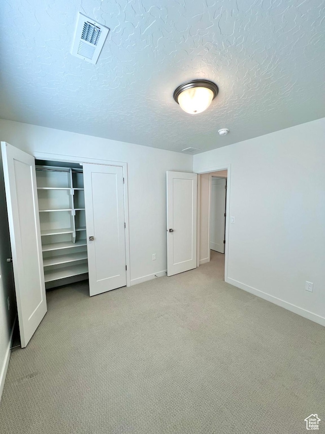 6293 W Jackson Crest Way, Herriman, UT 84096 - unfurnished bedroom with light carpet, a closet, baseboards, and visible vents