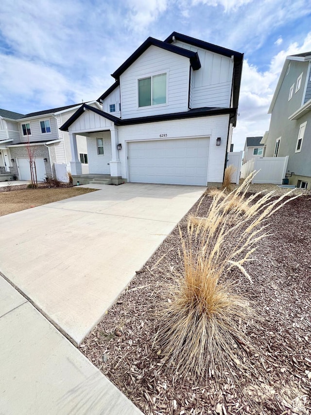 6293 W Jackson Crest Way, Herriman, UT 84096 - modern inspired farmhouse featuring board and batten siding, an attached garage, fence, and concrete driveway