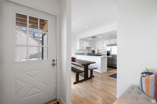 118 Davis Ct, Park City, UT 84060 - entryway with recessed lighting, light wood-type flooring, and a sink