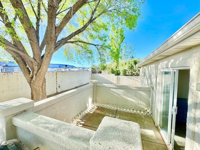 view of patio / terrace featuring fence