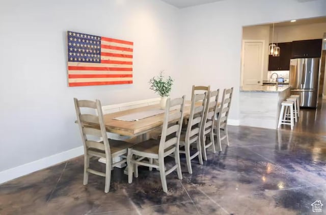 4277 W Canterbury Rd, Hurricane, UT 84737 - dining space with finished concrete flooring and baseboards