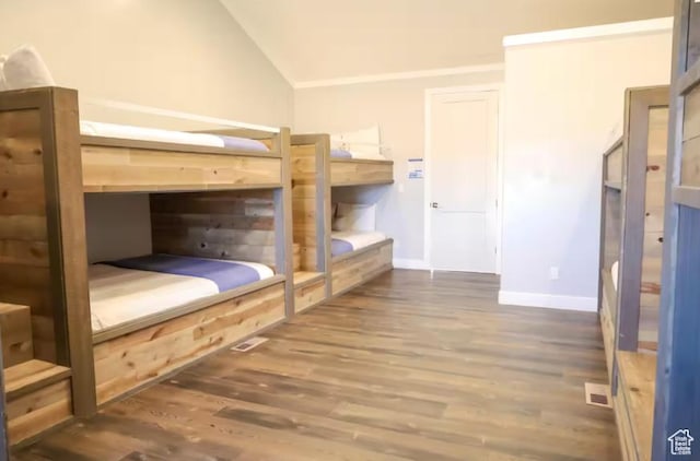 4277 W Canterbury Rd, Hurricane, UT 84737 - bedroom featuring wood finished floors, visible vents, baseboards, and lofted ceiling
