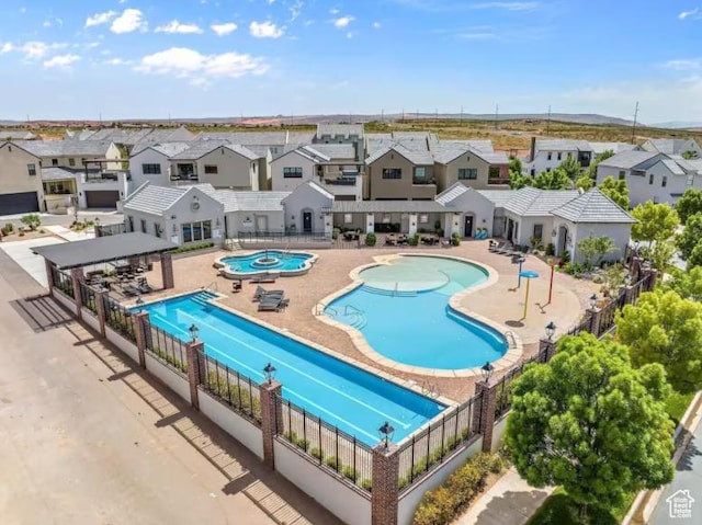 4277 W Canterbury Rd, Hurricane, UT 84737 - pool with a residential view, a patio, and fence
