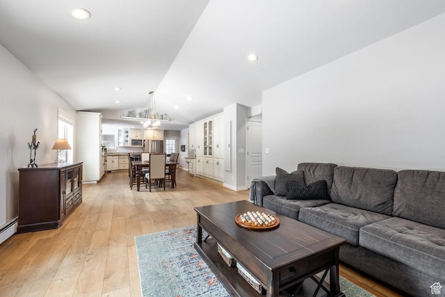 9106 N Upper Lando Ln, Park City, UT 84098 - living area featuring lofted ceiling, light wood-style floors, recessed lighting, and baseboards