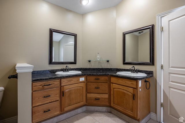 9106 N Upper Lando Ln, Park City, UT 84098 - bathroom with double vanity, tile patterned floors, and toilet