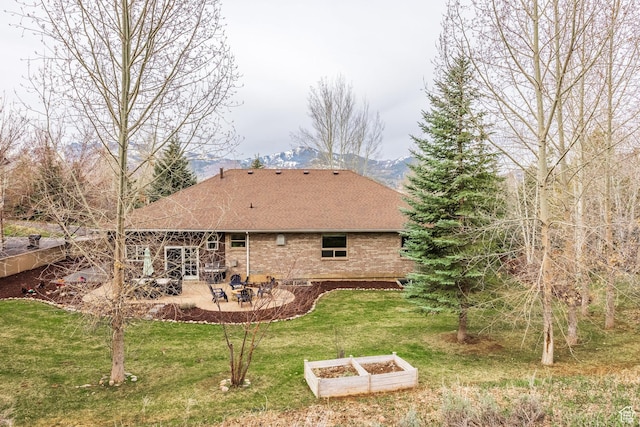 9106 N Upper Lando Ln, Park City, UT 84098 - back of house with a patio, a vegetable garden, a yard, roof with shingles, and brick siding