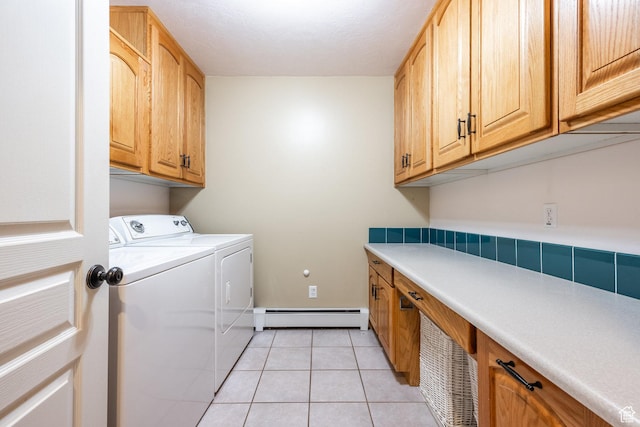 9106 N Upper Lando Ln, Park City, UT 84098 - washroom featuring baseboard heating, cabinet space, independent washer and dryer, light tile patterned floors, and baseboards