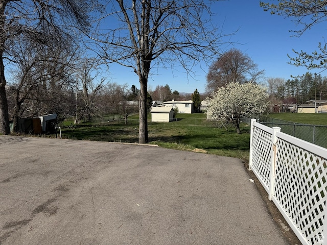 871 N Bonita Way E Unit 19, Centerville, UT 84014 - view of street with a gated entry and aphalt driveway