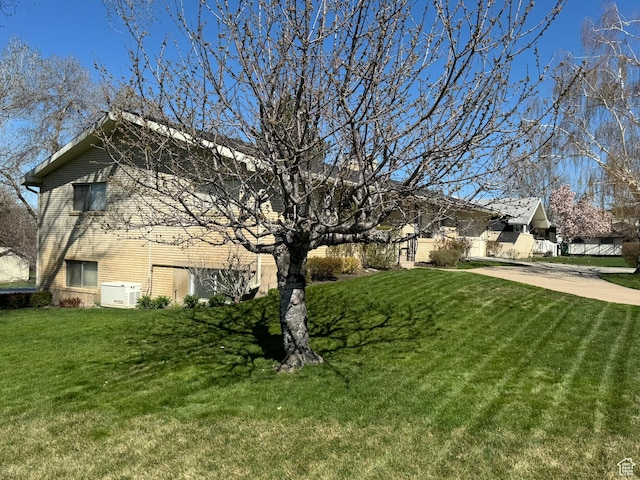 871 N Bonita Way E Unit 19, Centerville, UT 84014 - exterior space with a yard