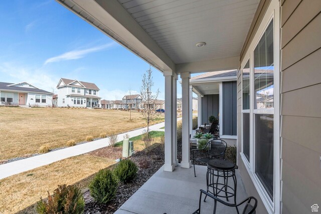 6156 W Poplar View Dr, South Jordan, UT 84009 - view of patio / terrace with a porch and a residential view