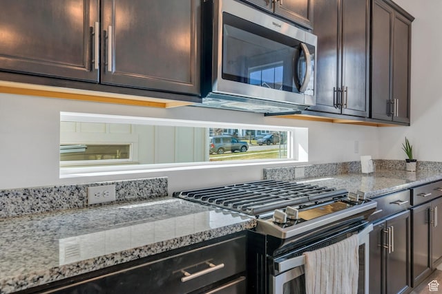 6156 W Poplar View Dr, South Jordan, UT 84009 - kitchen with dark brown cabinets, appliances with stainless steel finishes, and light stone counters
