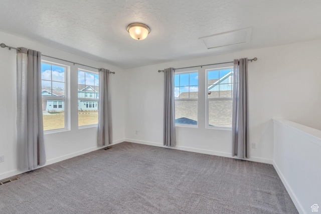 6156 W Poplar View Dr, South Jordan, UT 84009 - carpeted empty room with baseboards, visible vents, a textured ceiling, and attic access