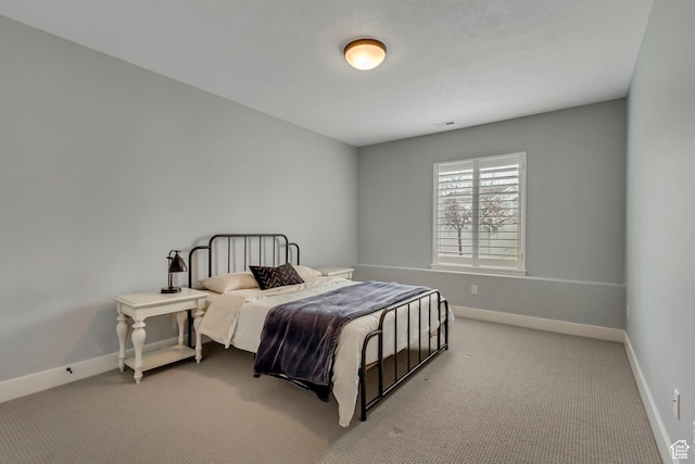 bedroom featuring baseboards, visible vents, and carpet floors