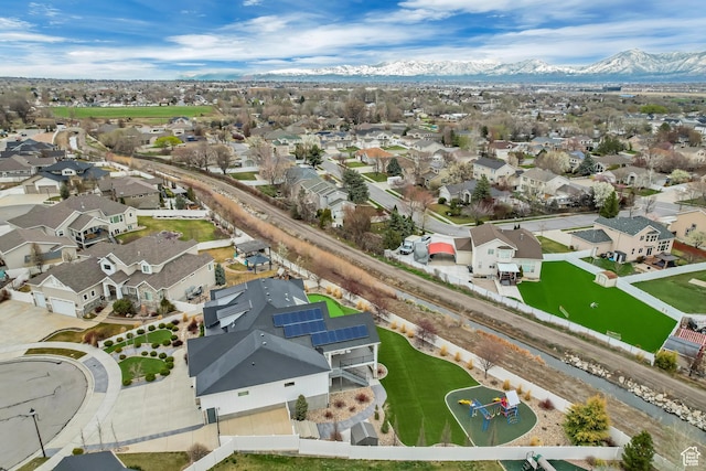birds eye view of property with a mountain view and a residential view