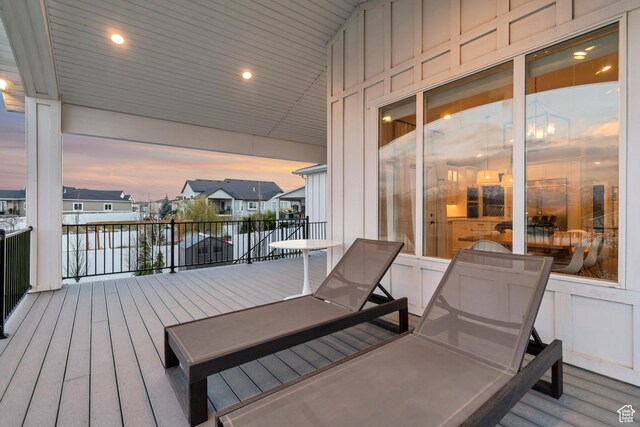 wooden deck featuring a residential view