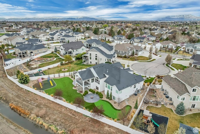 birds eye view of property with a mountain view and a residential view