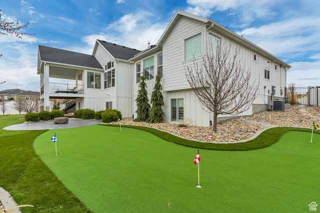 view of property's community featuring a patio, stairway, and fence
