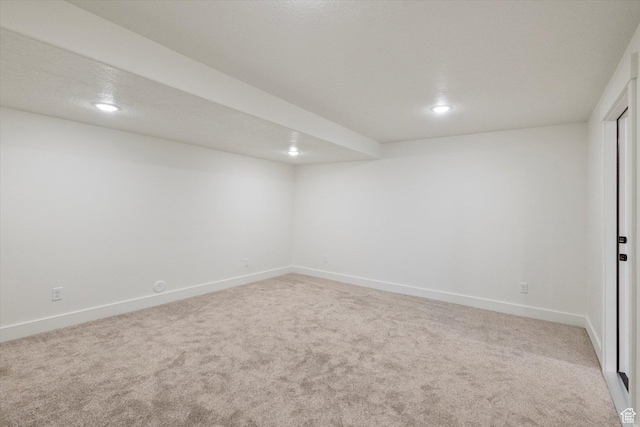 finished basement with baseboards, recessed lighting, and carpet flooring