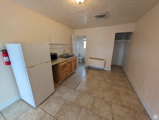 160 W 800 S, Payson, UT 84651 - kitchen with visible vents, a sink, light countertops, freestanding refrigerator, and stainless steel microwave