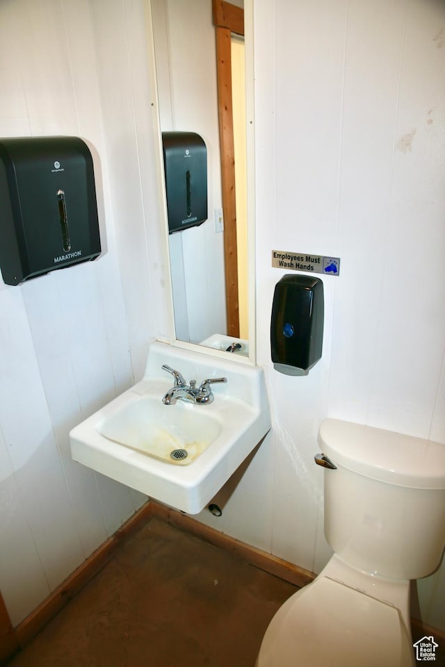 510 N Main St, Henefer, UT 84033 - half bath featuring a decorative wall, a sink, and toilet