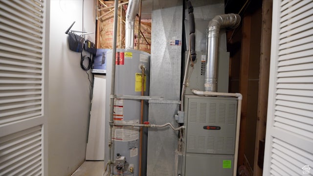 utility room featuring gas water heater