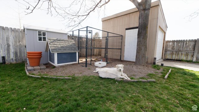 exterior space with exterior structure, a fenced backyard, and an outdoor structure