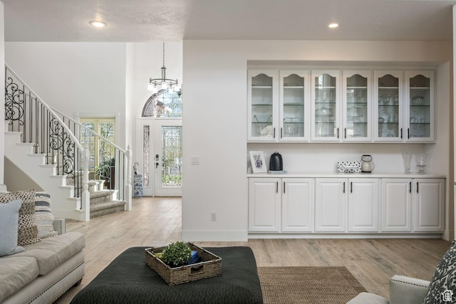 827 E 1070 S, St George, UT 84790 - living room featuring recessed lighting, an inviting chandelier, light wood-style floors, and stairs