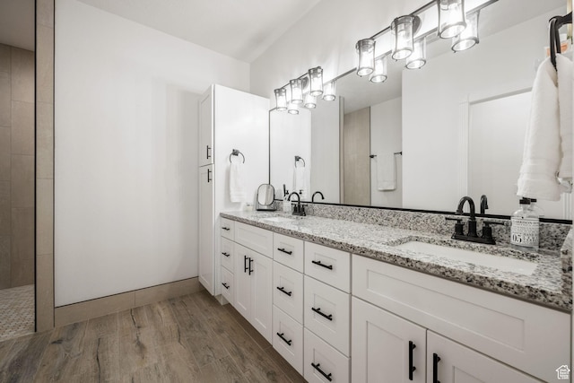 827 E 1070 S, St George, UT 84790 - bathroom with wood finished floors, double vanity, a sink, and tiled shower