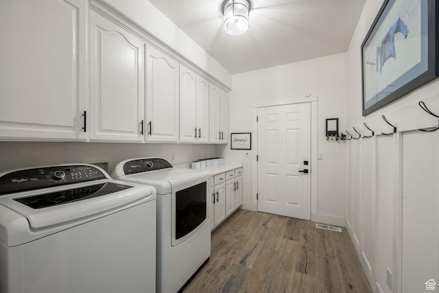 827 E 1070 S, St George, UT 84790 - washroom with visible vents, baseboards, wood finished floors, cabinet space, and washing machine and dryer