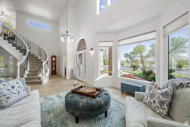827 E 1070 S, St George, UT 84790 - living room with a healthy amount of sunlight, a notable chandelier, and stairway
