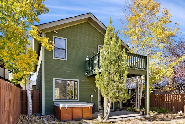 1036 Station Loop Rd, Park City, UT 84098 - rear view of property with a patio area, a fenced backyard, and a hot tub