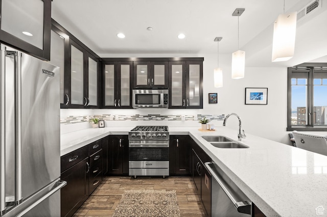 3700 Blackstone Dr Unit 9, Park City, UT 84098 - kitchen featuring premium appliances, dark wood-style flooring, a sink, and dark cabinets
