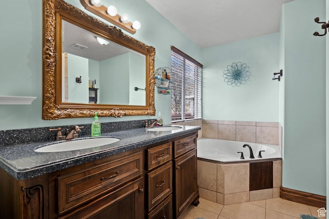 full bath with tile patterned floors, double vanity, a bath, and a sink