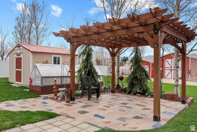 view of patio / terrace featuring a storage shed, fence, an outdoor structure, and a pergola