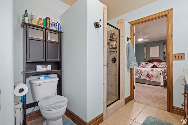 full bath featuring ensuite bathroom, toilet, a shower stall, and tile patterned floors