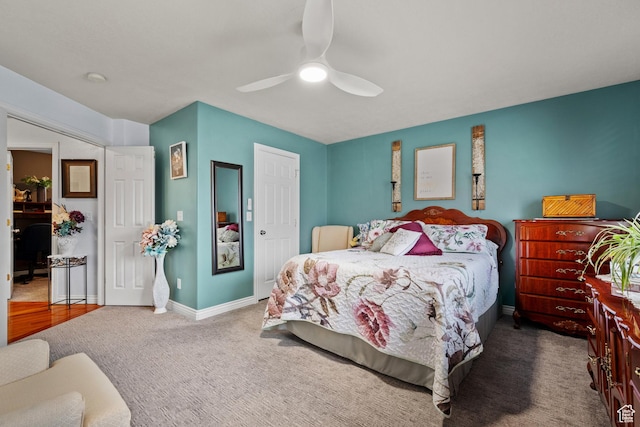 carpeted bedroom with baseboards and ceiling fan