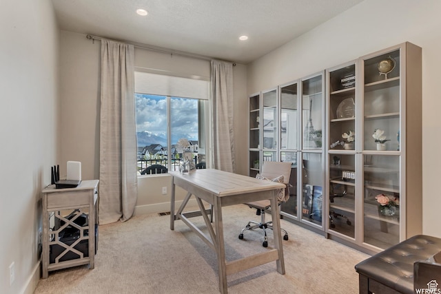 carpeted office space featuring baseboards and recessed lighting