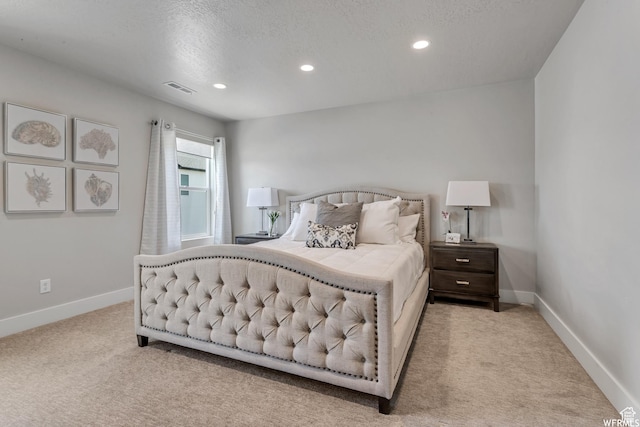 bedroom with recessed lighting, carpet flooring, visible vents, and baseboards