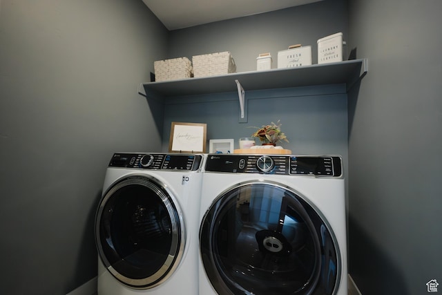 washroom with washer and dryer and laundry area