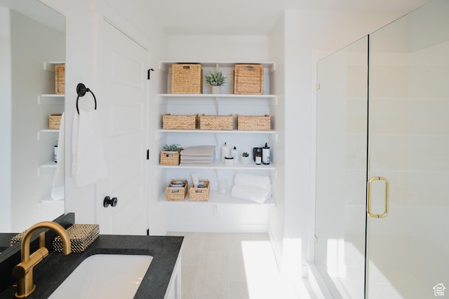 full bathroom featuring a shower stall and vanity