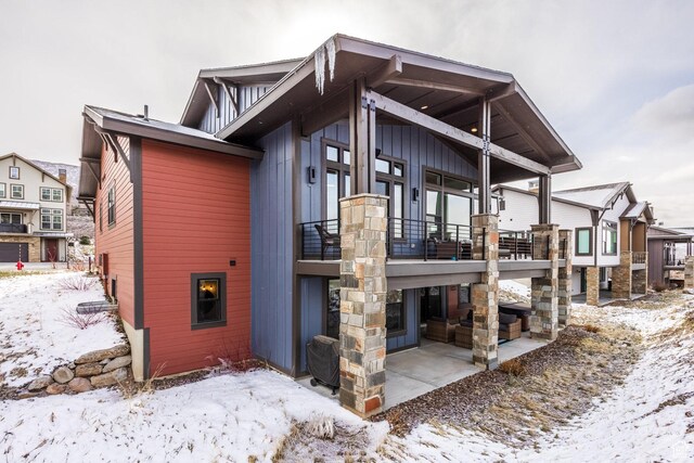 12709 N Belaview Way, Hideout, UT 84036 - snow covered back of property with a patio and a balcony