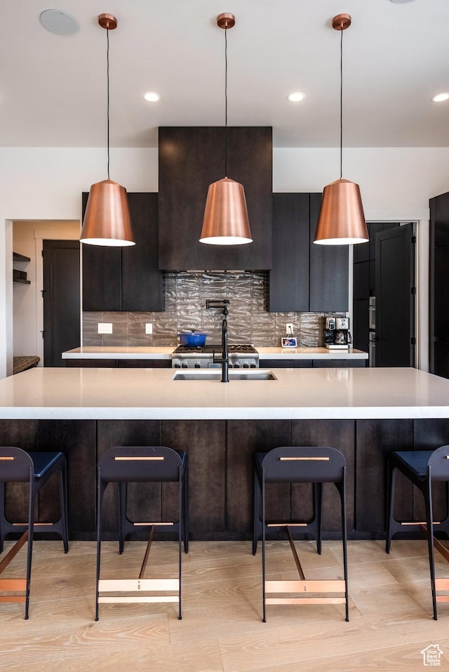 12709 N Belaview Way, Hideout, UT 84036 - kitchen featuring light countertops, decorative backsplash, and modern cabinets