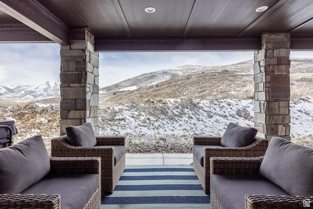 12709 N Belaview Way, Hideout, UT 84036 - snow covered patio featuring a mountain view and an outdoor living space