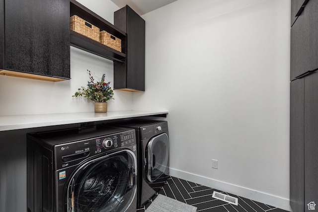 12709 N Belaview Way, Hideout, UT 84036 - clothes washing area featuring visible vents, washing machine and dryer, baseboards, and cabinet space