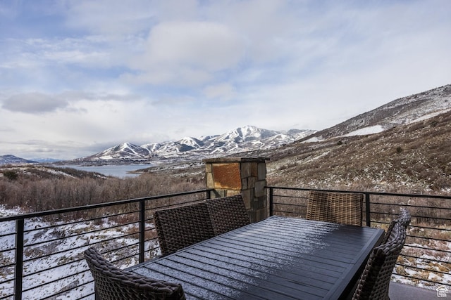 12709 N Belaview Way, Hideout, UT 84036 - snow covered deck with outdoor dining space and a mountain view