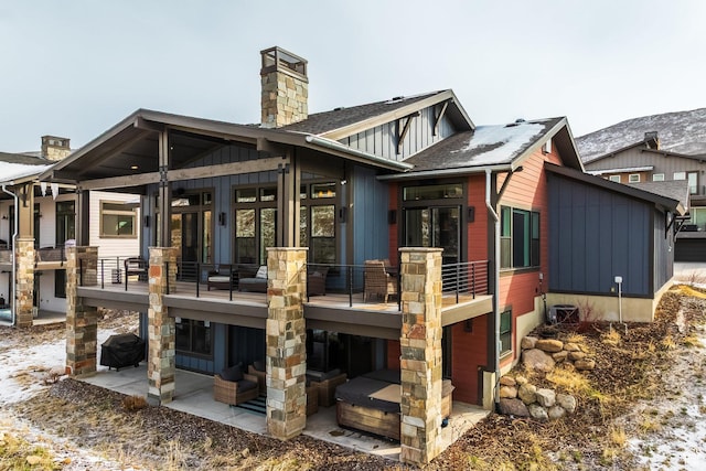 12709 N Belaview Way, Hideout, UT 84036 - rear view of house with a patio area, roof with shingles, board and batten siding, and a chimney
