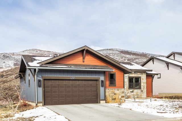 12709 N Belaview Way, Hideout, UT 84036 - view of front of property featuring a mountain view, an attached garage, stone siding, and driveway